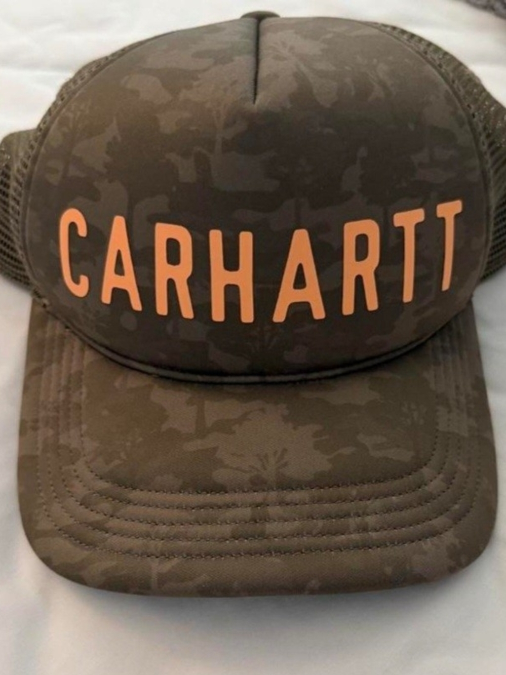Carhartt Trucker Hat in Olive Camo with Orange Logo